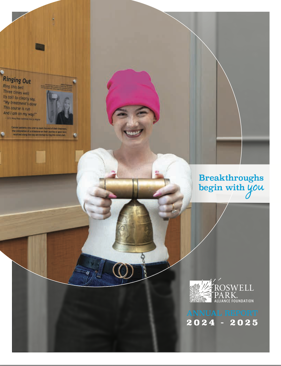 I girl holding a bell, signifying the end of cancer treatment
