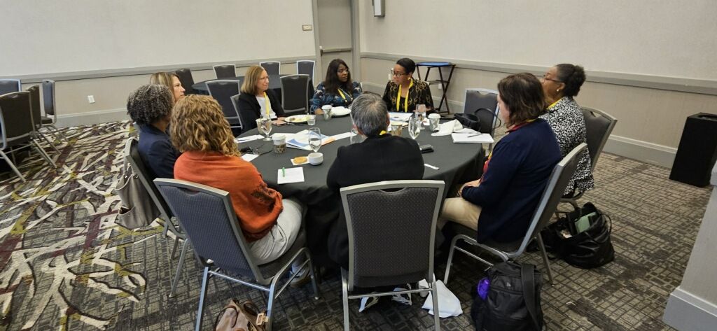 Nikia Clark, center, leads a roundtable discussion during the Cancer Center Community Impact Forum. 