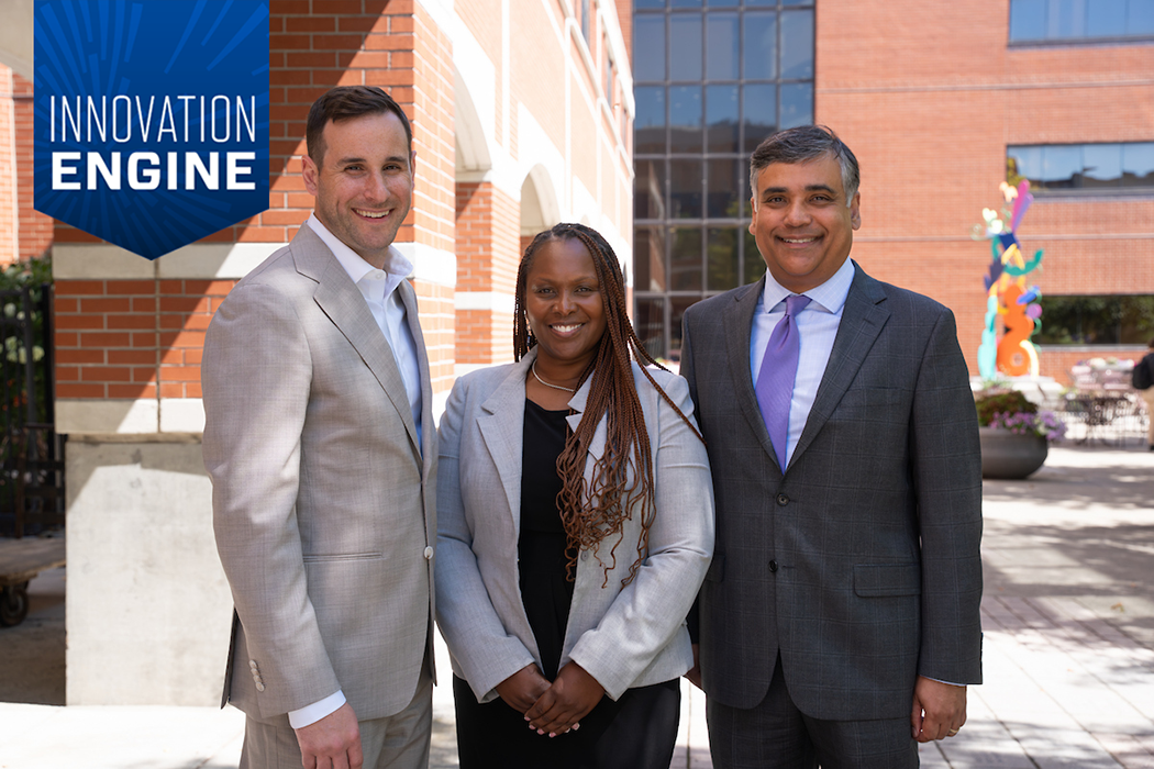 Three authors of a study pose for a photo outdoors in a park 