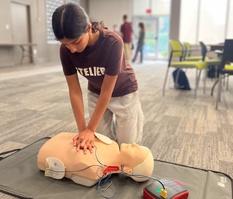 A student in the Buffalo Health Explorations program learns how to perform CPR