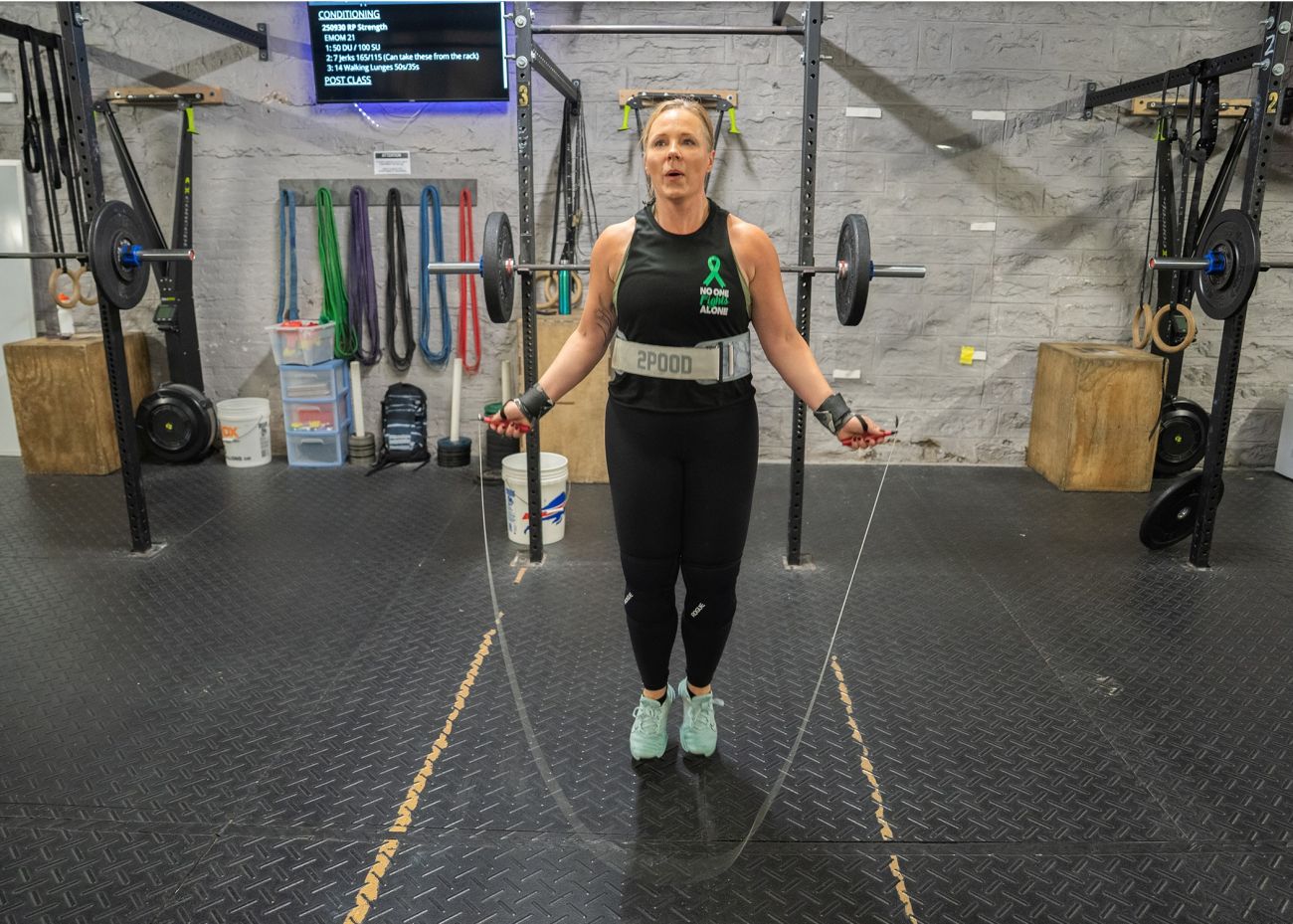 Doctor jumps rope in gym