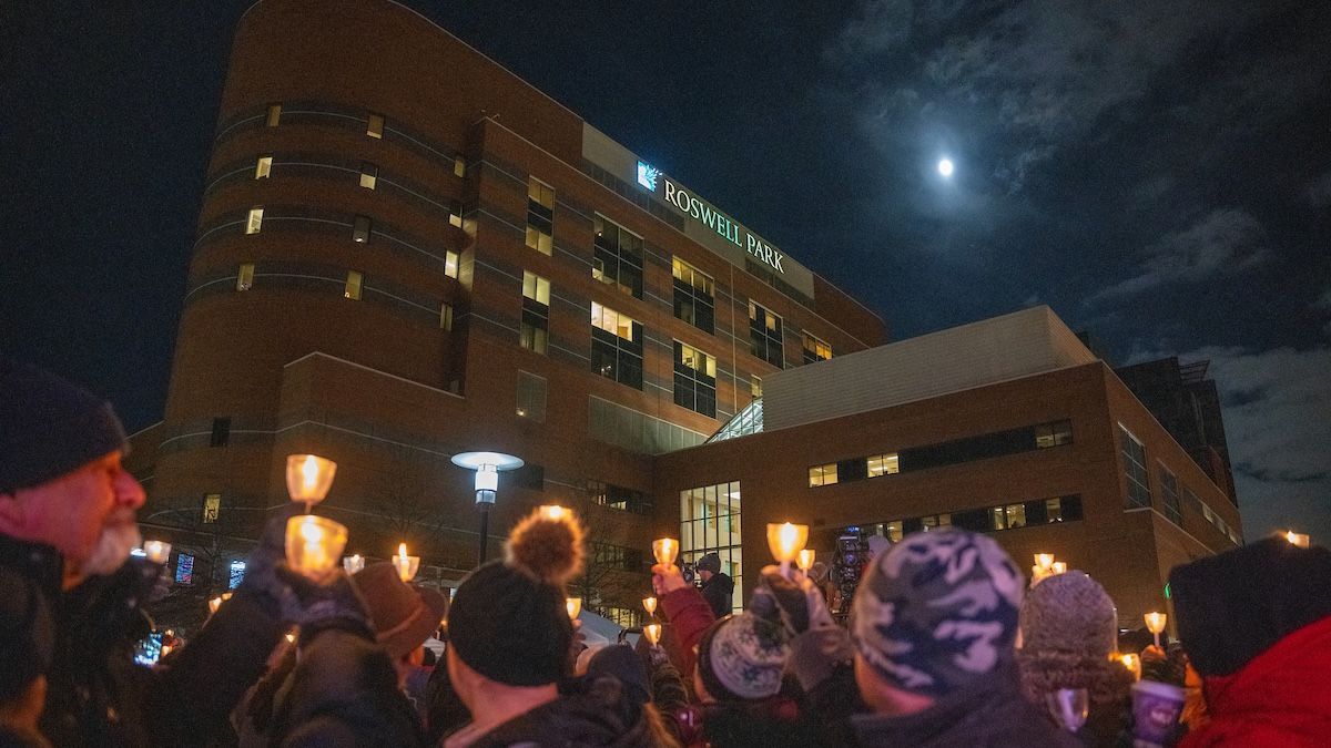 People light symbolic candles