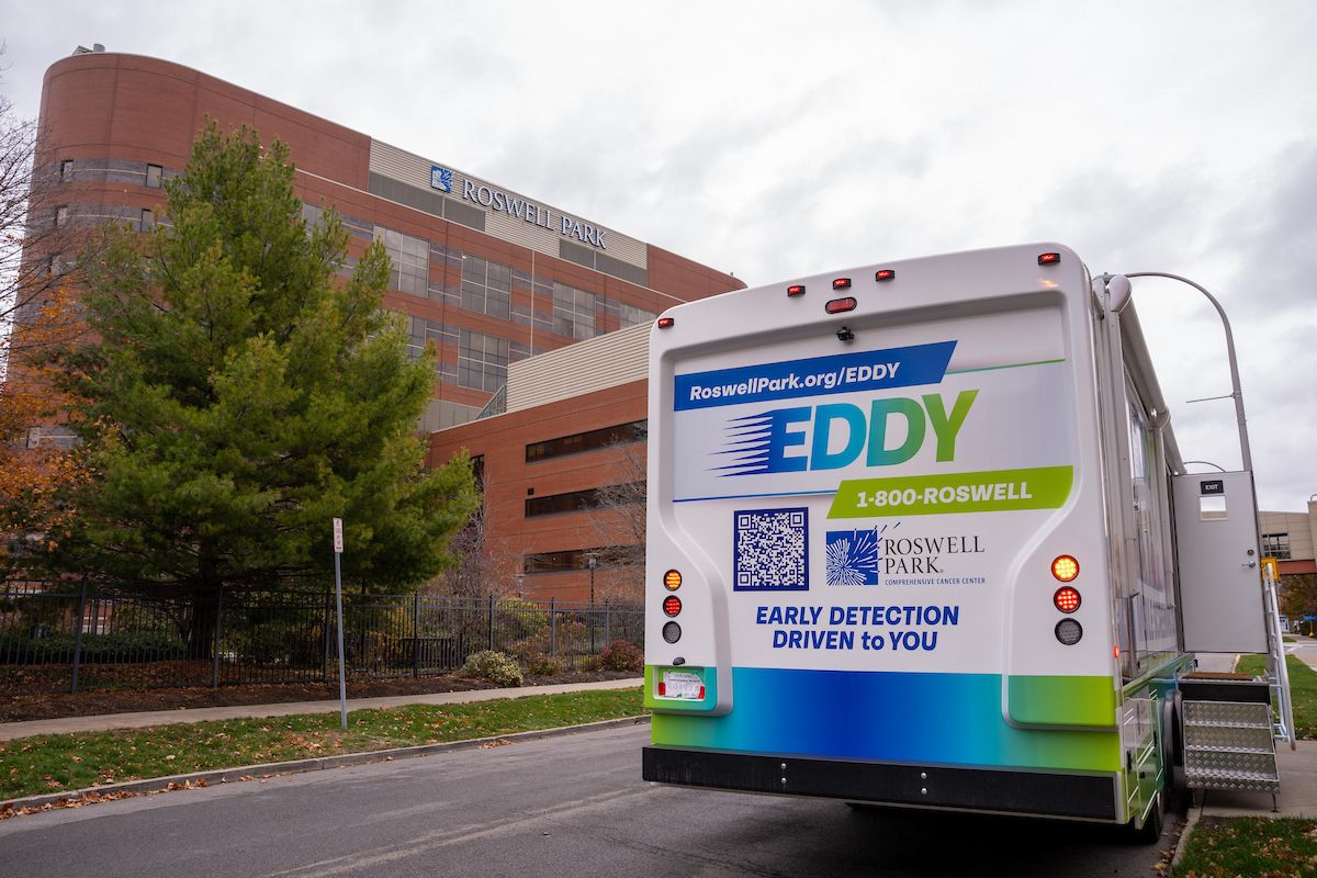 EDDY Mobile Screening Unit parked outside of Roswell Park with the building and sign in the background