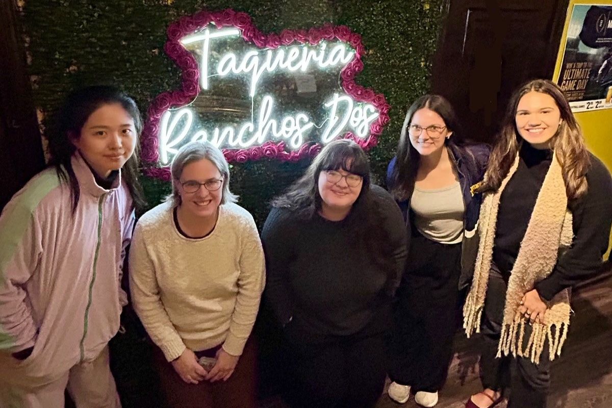 Women pose for a photo at a Mexican restaurant