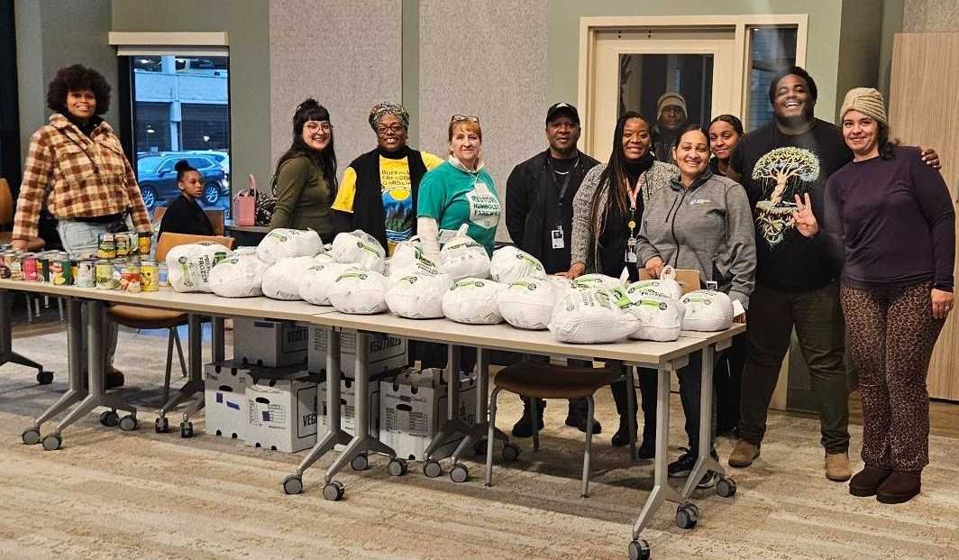 Volunteers help distribute turkeys at 907 Michigan, November 2025. 