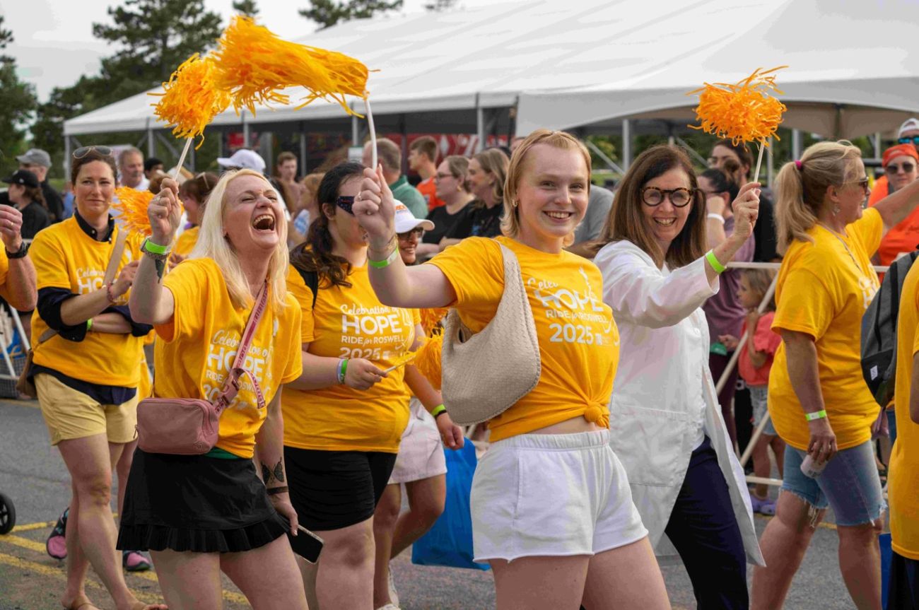 Dr. Kelly walking in Celebration of Hope with Sophia Baudo