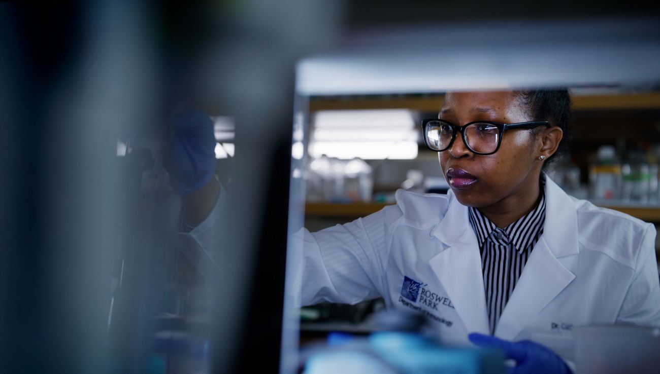 Doctor in lab coat doing research