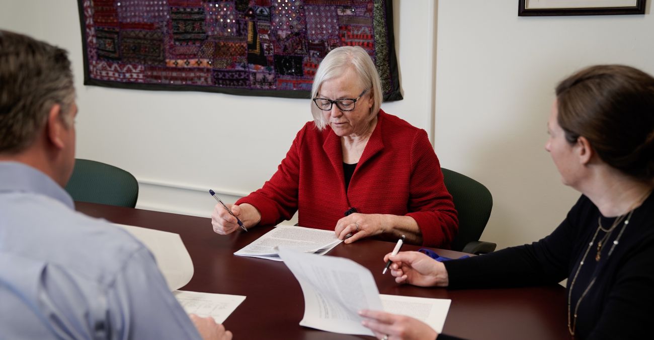 Scientists talking around a table