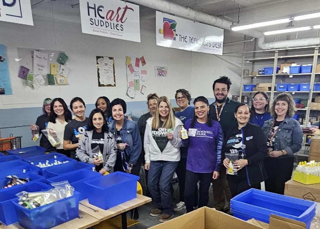 Roswell Park volunteers help out at the Teacher's Desk with school supplies. 