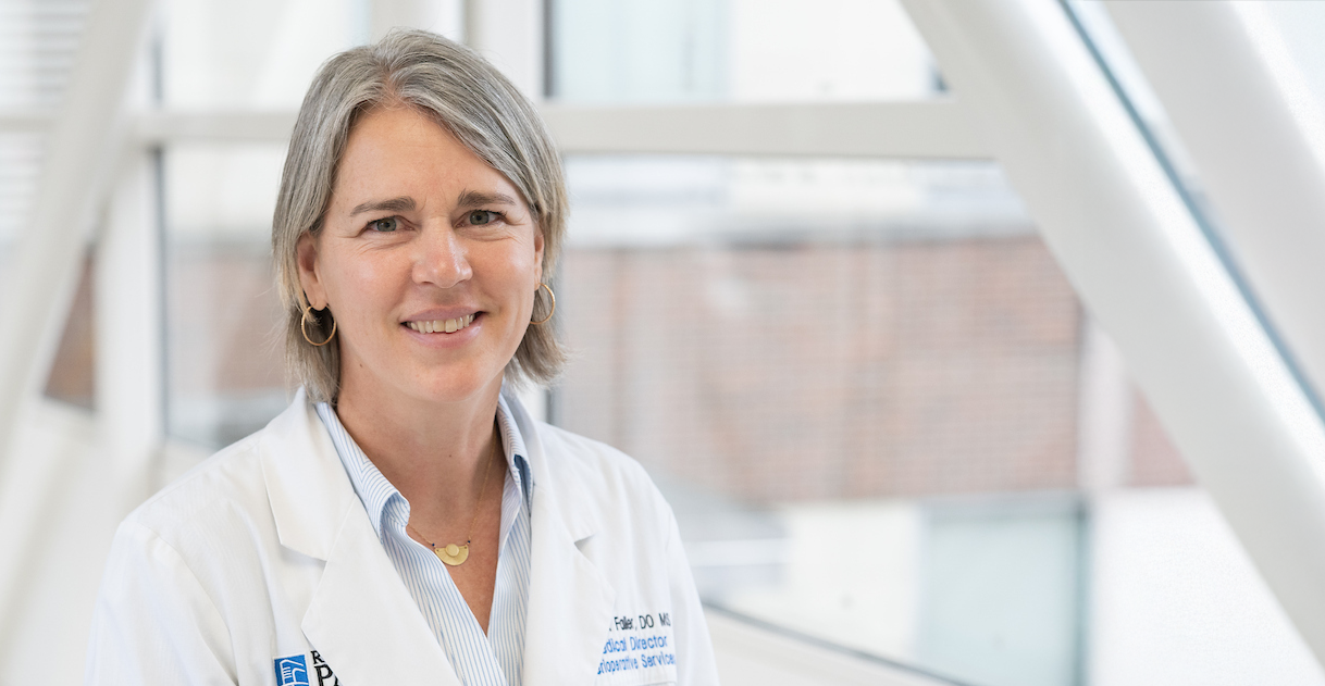Dr. Julia Faller headshot with expanded room on the right side of the image
