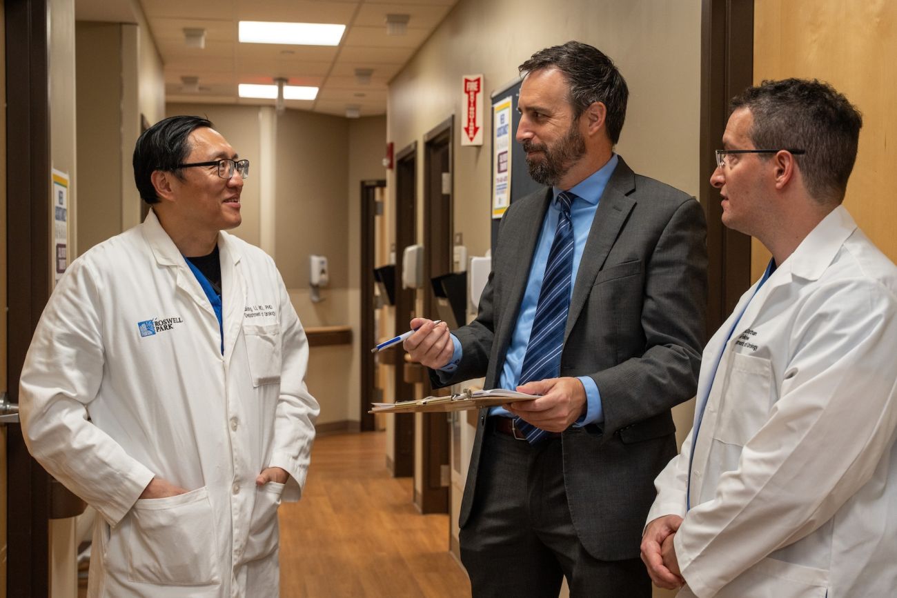 A group of doctors discuss a case