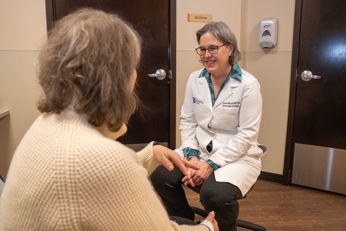 Dr. Karen McLean speaks with a female patient in clinic 
