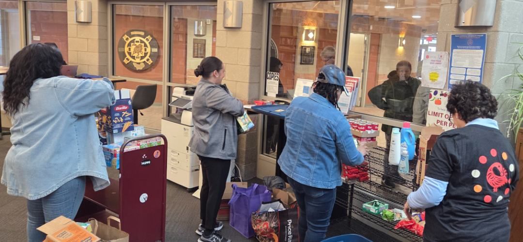 Roswell Park employees volunteer to fill a pantry on May 14, 2026. 