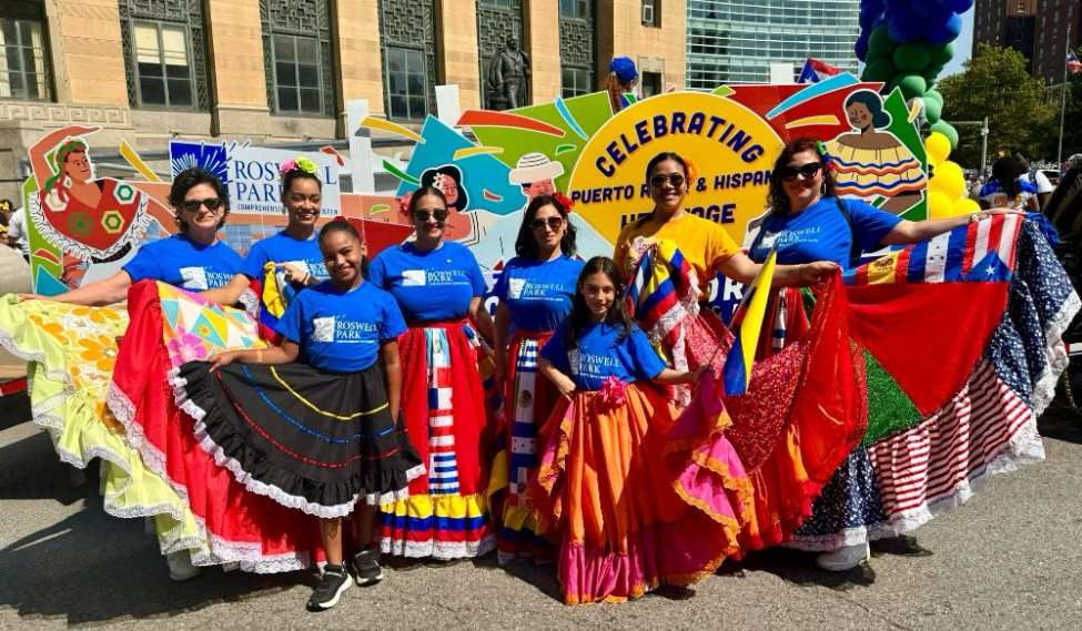 Roswell employees at the Hispanic Heritage Parade stand in front of City Hall.