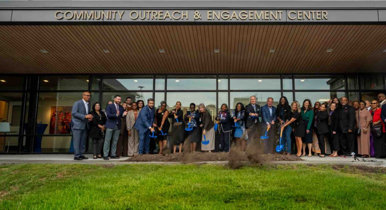 Group of people with shovels break ground on new building