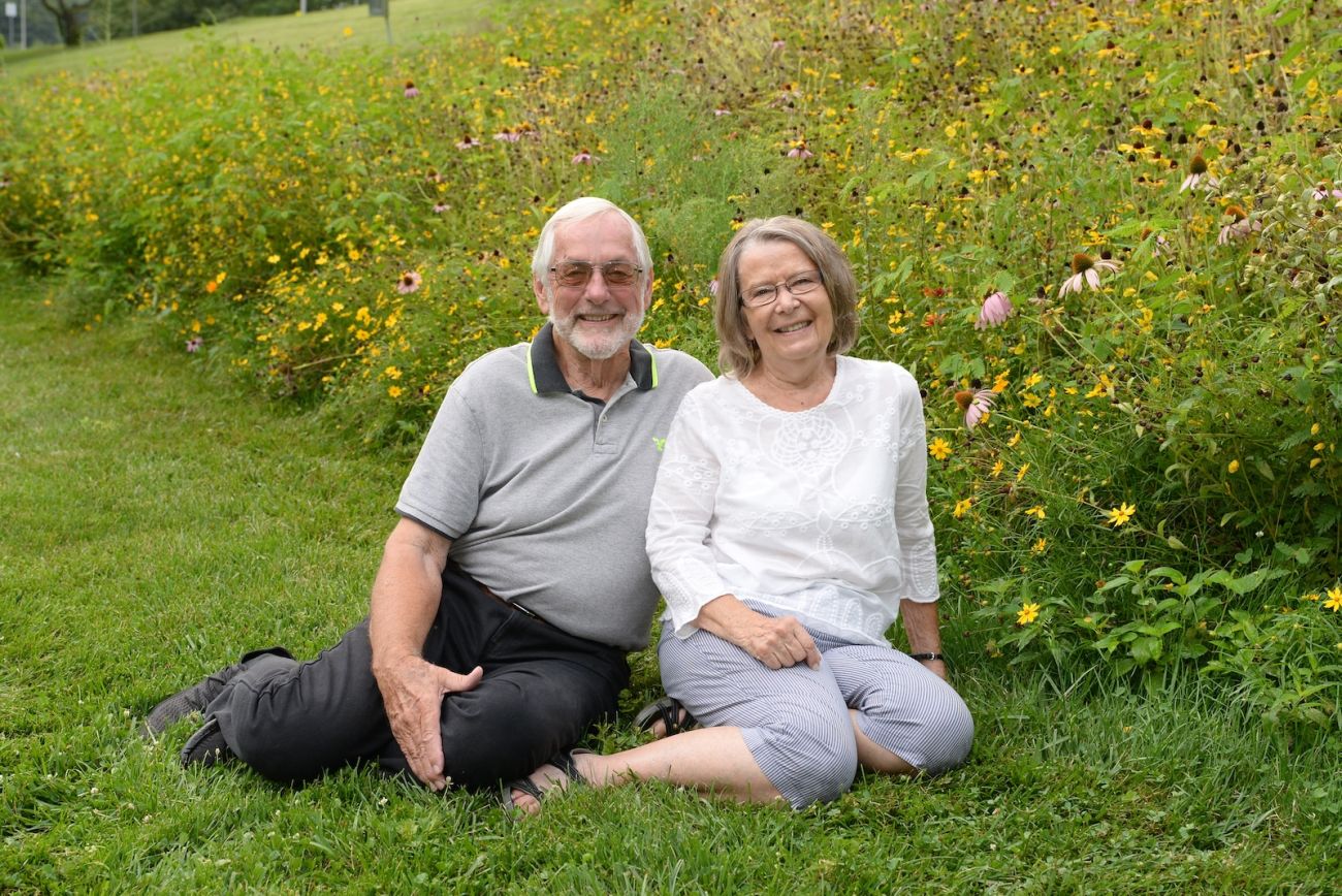 Esophageal patient William Strunk and his wife Patricia, pose in a fieldE