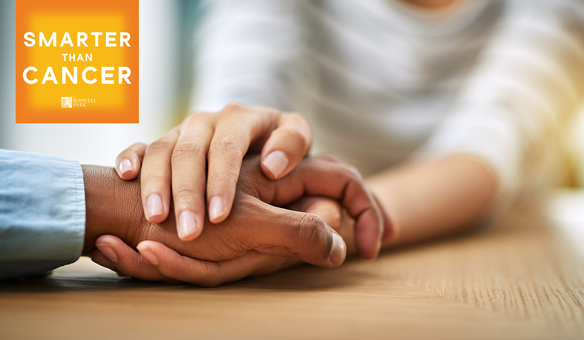 Two people holding hands with the Smarter than Cancer logo in the left corner