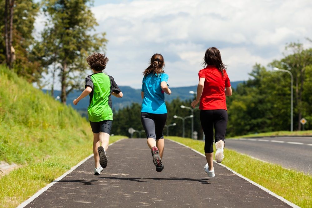 Three people jogging