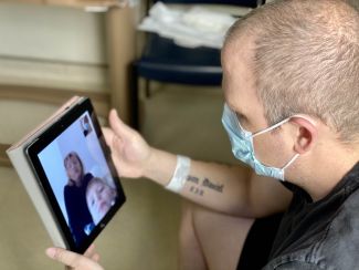 Patient video chatting with family on iPad