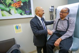 Dr. Saby George treats a patient with prostate cancer