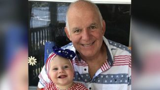 Patient Doug Green with his granddaughter 