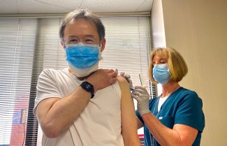 Dr. Phillip McCarthy receives his COVID-19 vaccine.