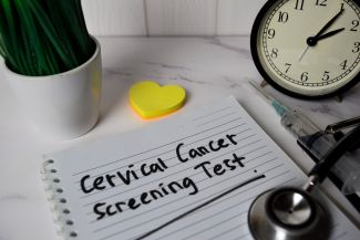 Cervical cancer screening test reminder on a notebook