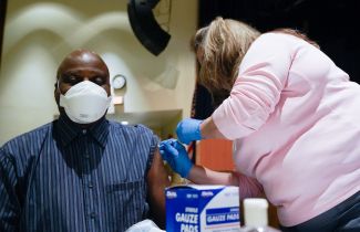 Man getting vaccinated.