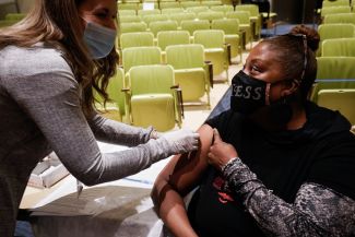 Dee Johnson, director of the Witness Project, received her vaccine to fight COVID-19. 
