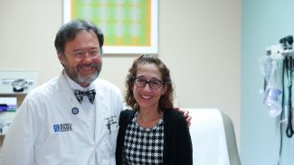 Dr. Philip McCarthy smiling next to Rachel, a Roswell Park transplant patient.