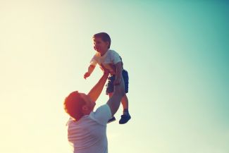 Father holding his son up in the air