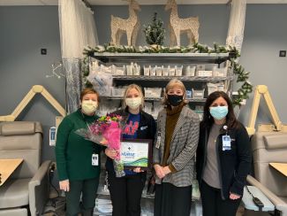 Rose Yartz, second from left, was named Nurse of the Month for January and received her award from nursing supervisors and Roswell Park CEO Candace Johnson.