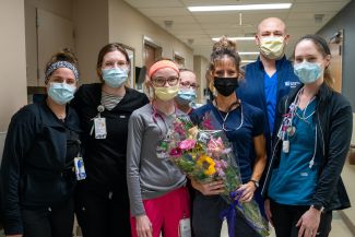 Jennifer Lindemann, second from right, is surrounded by her team as she is honored as the Nurse of the Month for March. 