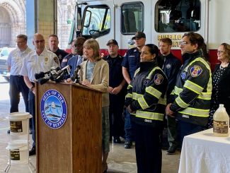 Dr. Johnson speaks at May 2022 press conference with Buffalo mayor and Buffalo Fire Department personnel