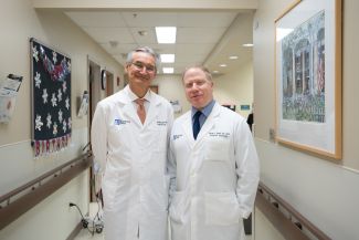 Dr. Benjamin Calvo and Dr. Steven Nurkin pose together in clinic
