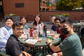 Group of Roswell employees eating