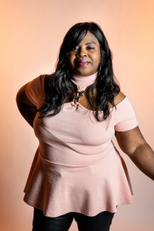 Aretha Graham poses for the Elevate Salon to promote their services